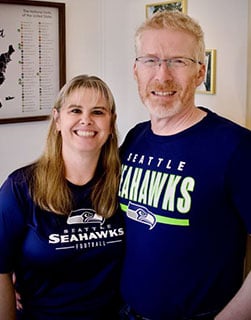 Jennifer and Kurt Bennett in their Seattle Seahawks shirts